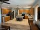 Spacious kitchen featuring wood cabinets, stainless steel appliances, and a center island at 4130 E Megan St, Gilbert, AZ 85295