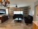 Cozy living room with comfortable seating, wood-look floors, and abundant natural light at 4130 E Megan St, Gilbert, AZ 85295