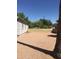 A large gravel backyard with fence providing privacy and an open space for outdoor activities at 42 W Thomas Ln, Tempe, AZ 85281