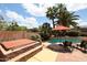 Beautiful backyard featuring a hot tub, pool, and outdoor furniture, perfect for relaxing and entertaining at 4441 E Sunnyside Ln, Phoenix, AZ 85032