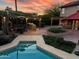 Outdoor oasis featuring a covered patio, a hot tub, and lush landscaping at 4441 E Sunnyside Ln, Phoenix, AZ 85032