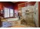 Elegant bathroom featuring a soaking tub, walk-in shower and lots of natural light at 4441 E Sunnyside Ln, Phoenix, AZ 85032