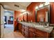 Bathroom with double vanities and granite counters at 4441 E Sunnyside Ln, Phoenix, AZ 85032