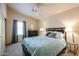 Cozy bedroom with plush bedding, soft lighting, and a serene atmosphere at 4441 E Sunnyside Ln, Phoenix, AZ 85032