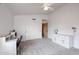 Bright bedroom with neutral carpet and white walls with a desk and sliding closet doors for plenty of storage at 4441 E Sunnyside Ln, Phoenix, AZ 85032