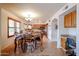 Eat-in dining room showcasing beautiful wood table and complementary tile floors at 4441 E Sunnyside Ln, Phoenix, AZ 85032
