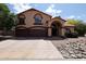 Charming two-story home featuring a terracotta roof and three-car garage at 4441 E Sunnyside Ln, Phoenix, AZ 85032