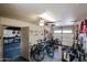 Spacious garage with a ceiling fan and ample space for parking and storage, plus lots of bikes at 4441 E Sunnyside Ln, Phoenix, AZ 85032
