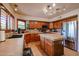 Bright kitchen with a tiled island, stainless steel refrigerator and stylish cabinetry at 4441 E Sunnyside Ln, Phoenix, AZ 85032