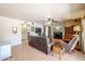 Cozy living room featuring a fireplace, ceiling fan, and comfortable seating at 4441 E Sunnyside Ln, Phoenix, AZ 85032