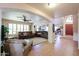 Open-concept living room featuring tile flooring, and an archway to the foyer at 4441 E Sunnyside Ln, Phoenix, AZ 85032