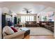 Large living room featuring a ceiling fan, neutral paint, and comfortable furnishings at 4441 E Sunnyside Ln, Phoenix, AZ 85032