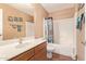 Well-maintained bathroom with a vanity, toilet, shower and bathtub, offering a functional and clean space at 44454 W Oster Dr, Maricopa, AZ 85138