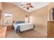 Inviting bedroom with vaulted ceilings, plush carpeting, and natural light at 44454 W Oster Dr, Maricopa, AZ 85138
