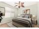 Well-lit bedroom complete with elegant decor, a large bed, and soft lighting at 44454 W Oster Dr, Maricopa, AZ 85138