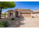 Charming single-story home with desert landscaping, a two-car garage, and a welcoming front entry at 44454 W Oster Dr, Maricopa, AZ 85138