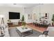 Spacious living room and dining room with modern decor and ample natural light at 44454 W Oster Dr, Maricopa, AZ 85138