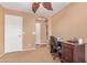 Bedroom provides versatile office space with carpet, desk, chair, and recliner for comfortable work or study at 44454 W Oster Dr, Maricopa, AZ 85138