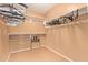 Spacious walk-in closet featuring wall-mounted shelf and rod organizers at 44454 W Oster Dr, Maricopa, AZ 85138