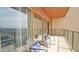 Balcony with comfortable seating, city views, and clear glass sliders at 4750 N Central Ave # D15, Phoenix, AZ 85012