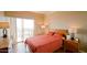 Cozy bedroom filled with natural light from a sliding glass door, with warm, inviting tones at 4750 N Central Ave # D15, Phoenix, AZ 85012