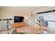 Well-lit living room offering a TV, access to kitchen area, and a telescope for city viewing at 4750 N Central Ave # D15, Phoenix, AZ 85012