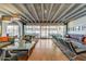Spacious lounge area with hardwood floors, floor-to-ceiling windows, and comfortable seating at 4750 N Central Ave # D15, Phoenix, AZ 85012