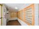 Hallway view of the community mailboxes framed in natural wood at 4750 N Central Ave # D15, Phoenix, AZ 85012
