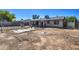 Spacious backyard with patio and exterior of home offers a canvas for landscaping and outdoor living at 4870 W Almeria Rd, Phoenix, AZ 85035
