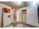 A bedroom that needs repair featuring a closet and doorway at 4870 W Almeria Rd, Phoenix, AZ 85035