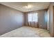 A standard bedroom with window overlooking the outside at 4870 W Almeria Rd, Phoenix, AZ 85035