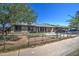 Modest single-story home with a chain link fence and desert landscaping in need of renovation at 4870 W Almeria Rd, Phoenix, AZ 85035