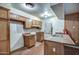 Modest kitchen area featuring wood cabinetry and countertop with a sink at 4870 W Almeria Rd, Phoenix, AZ 85035
