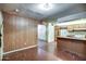 The home features an open living and kitchen area with natural lighting at 4870 W Almeria Rd, Phoenix, AZ 85035