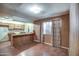 An open concept living room and kitchen with vinyl wood floors at 4870 W Almeria Rd, Phoenix, AZ 85035