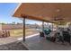 Covered patio with a view of the large, landscaped backyard and pool area at 4915 W Libby St, Glendale, AZ 85308