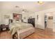 Well-lit bedroom featuring a ceiling fan and plenty of storage space at 4915 W Libby St, Glendale, AZ 85308