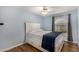 Bedroom with blue walls featuring a ceiling fan and a large window at 4915 W Libby St, Glendale, AZ 85308