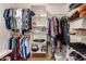 Walk-in closet featuring shelving, hanging rods, and ample storage space at 4915 W Libby St, Glendale, AZ 85308