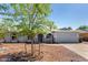 Well-maintained single-story home featuring desert landscaping, light blue exterior paint, and a two-car garage at 4915 W Libby St, Glendale, AZ 85308