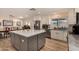 Spacious eat-in kitchen with stainless steel appliances, a breakfast nook, and a large gray island at 4915 W Libby St, Glendale, AZ 85308