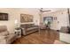 Cozy living room with hardwood floors, a ceiling fan, and lots of natural light at 4915 W Libby St, Glendale, AZ 85308