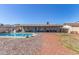 Backyard with a private pool, covered patio, and desert landscaping for relaxing outdoor living at 4915 W Libby St, Glendale, AZ 85308