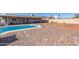 Inviting in-ground pool and expansive outdoor space with rocks and desert landscaping at 4915 W Libby St, Glendale, AZ 85308