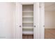 Spacious linen closet featuring ample shelving, perfect for organized storage and easy access at 511 E Calavar Rd, Phoenix, AZ 85022