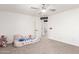 Carpeted room with ceiling fan, bed, and decorative accents at 5322 N Oro Vista Ct, Litchfield Park, AZ 85340
