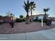 Charming home featuring mature palm trees and low-maintenance desert landscaping at 5322 N Oro Vista Ct, Litchfield Park, AZ 85340