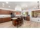 Well-lit kitchen with wooden cabinets, granite countertops, and stainless steel appliances at 5322 N Oro Vista Ct, Litchfield Park, AZ 85340