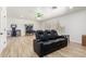 Cozy living room with stylish seating, hardwood floors, and ample natural light at 5322 N Oro Vista Ct, Litchfield Park, AZ 85340