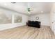 Bright living room with two windows, hardwood floors, and comfortable seating at 5322 N Oro Vista Ct, Litchfield Park, AZ 85340